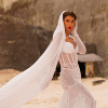 Айза-Лилуна Ай прокомментировала снимки в свадебном платье 